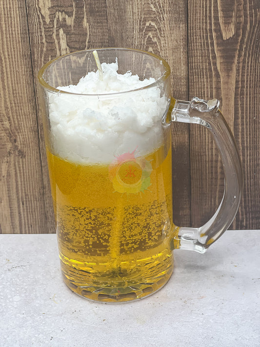 Candle in mug glass jar. Candle made to look like beer with foam on top. 