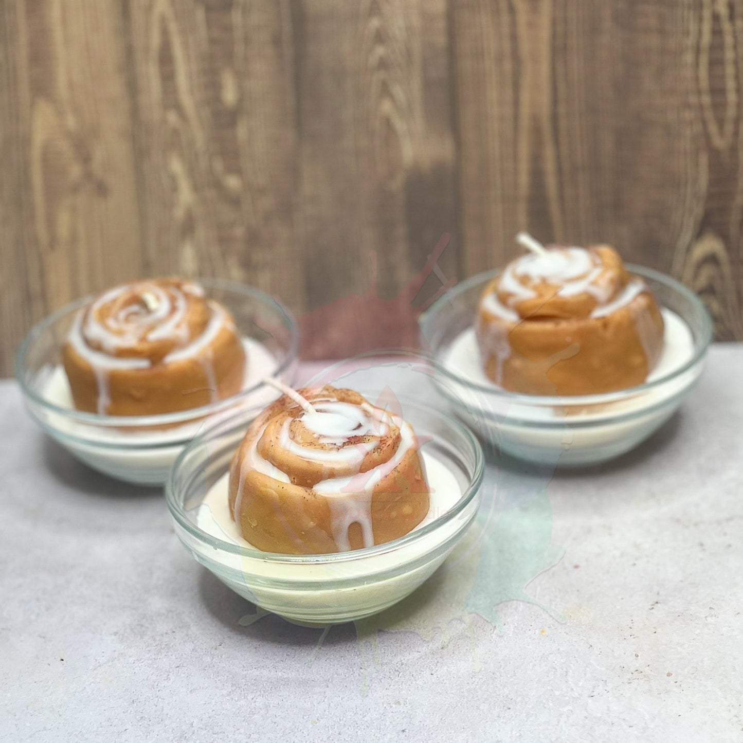 Photo of Cinnamon Roll Candle in a tiny bowl. Front View