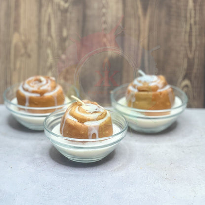 Photo of Cinnamon Roll Candle in a tiny bowl. Front View