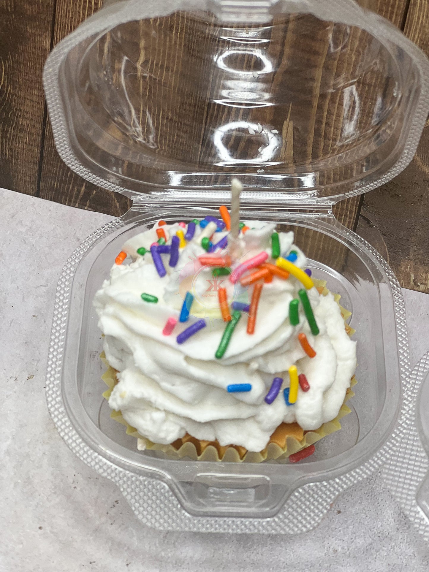Photo of candle made to look like birthday cupcake.