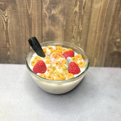 Photo of bowl of cereal. Cheerios and Strawberry candle made to mimic real bowl of cereal.